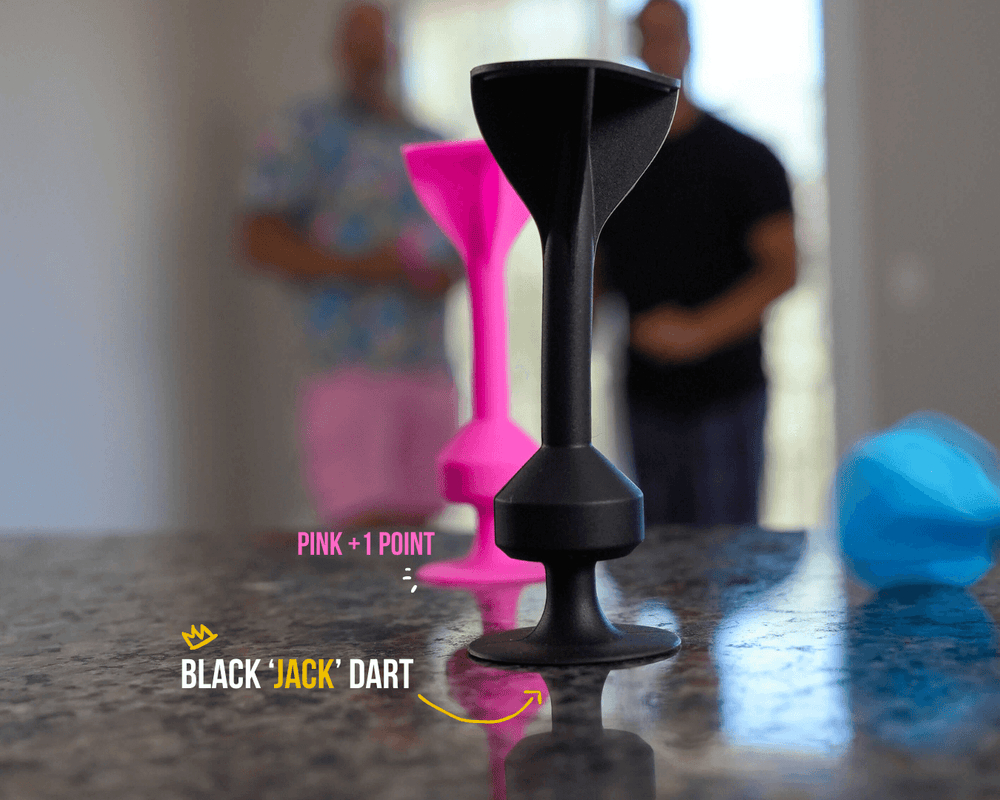 Players taking turns tossing colored darts toward the black jack dart