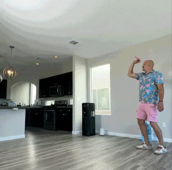 A high arcing throw that drops the dart onto a distant target