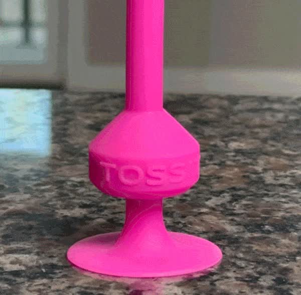 A dart sticking cleanly to a smooth kitchen countertop